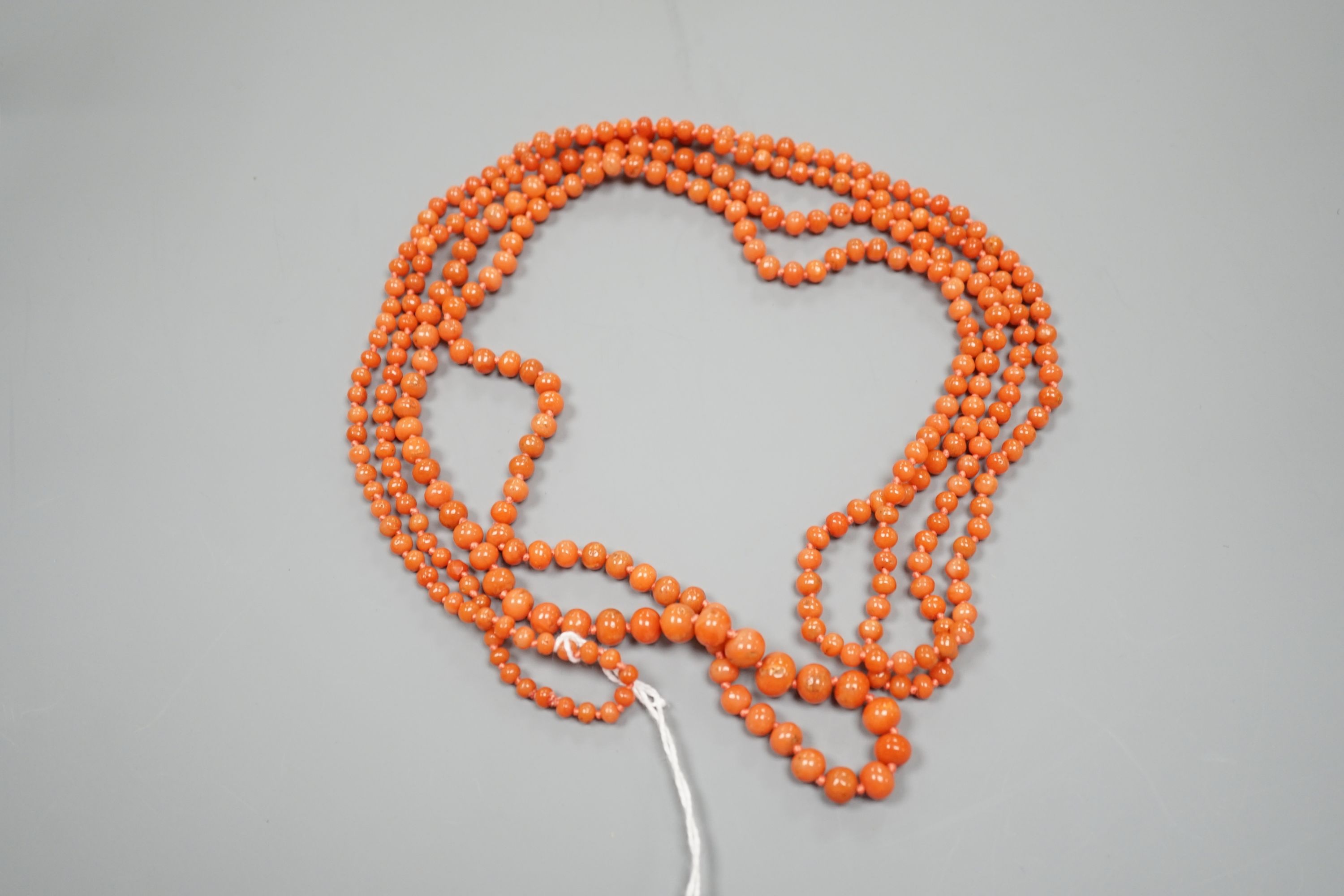 A single strand graduated coral bead necklace, 154cm, gross weight 48 grams.